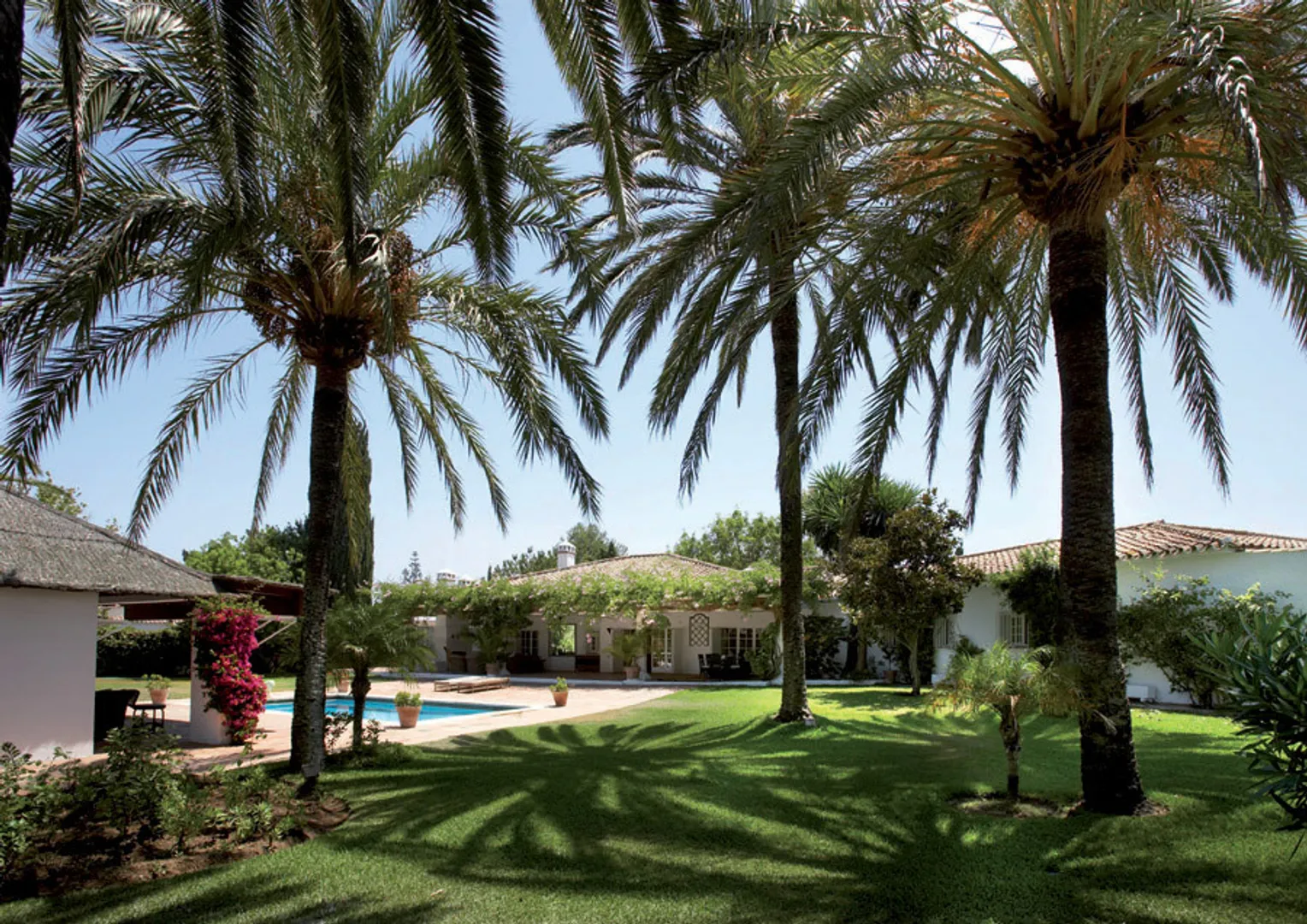 Rustic villa on the golf course with heated pool and bar shack.